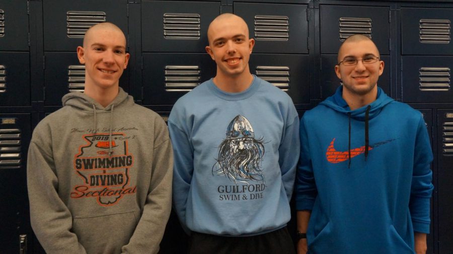 Swimmers Ian Burley, Jacob Stroup,and Nolan Steingraber display their shaved heads following the Boys Swim Team tradition of bleaching their hair white for a week late in the season.