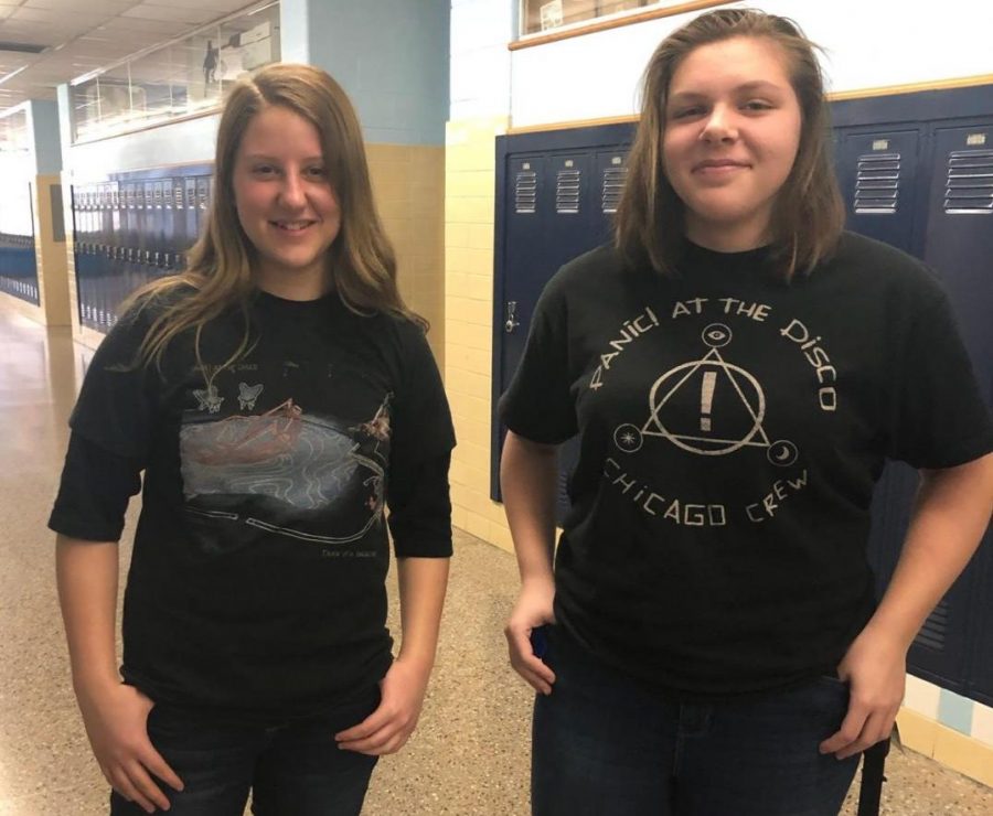Sophomores Amelia Milks and Olivia Mosny show off their Panic! at the Disco shirts, celebrating the 200-2010 decade.