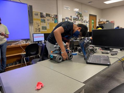 Vedant Patel, a freshman at Auburn High School, assembles one of the Robomasters.