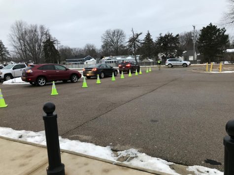 Parents exit the student parking lot on Friday, Jan 14.
