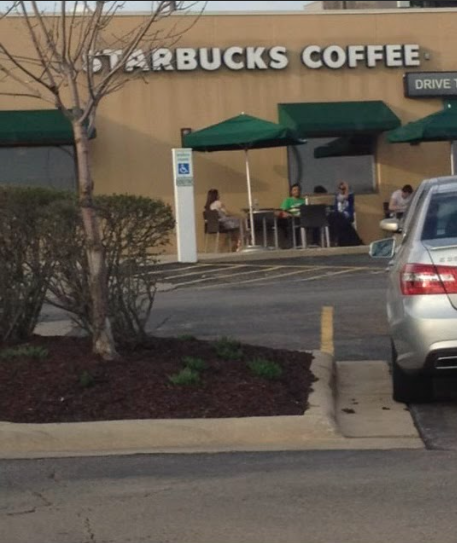 Patrons enjoy outside service at Starbucks on E State St.