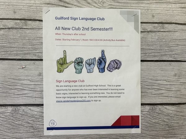 A flyer for the sign language club hangs in the cafeteria.