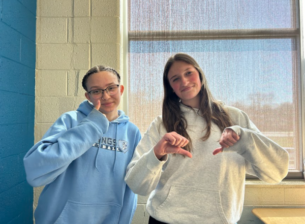 Malia Welch gives a thumbs up because she was given the opportunity to learn these things in middle school, while Jaden Larsen gives a thumbs down because she did not.
